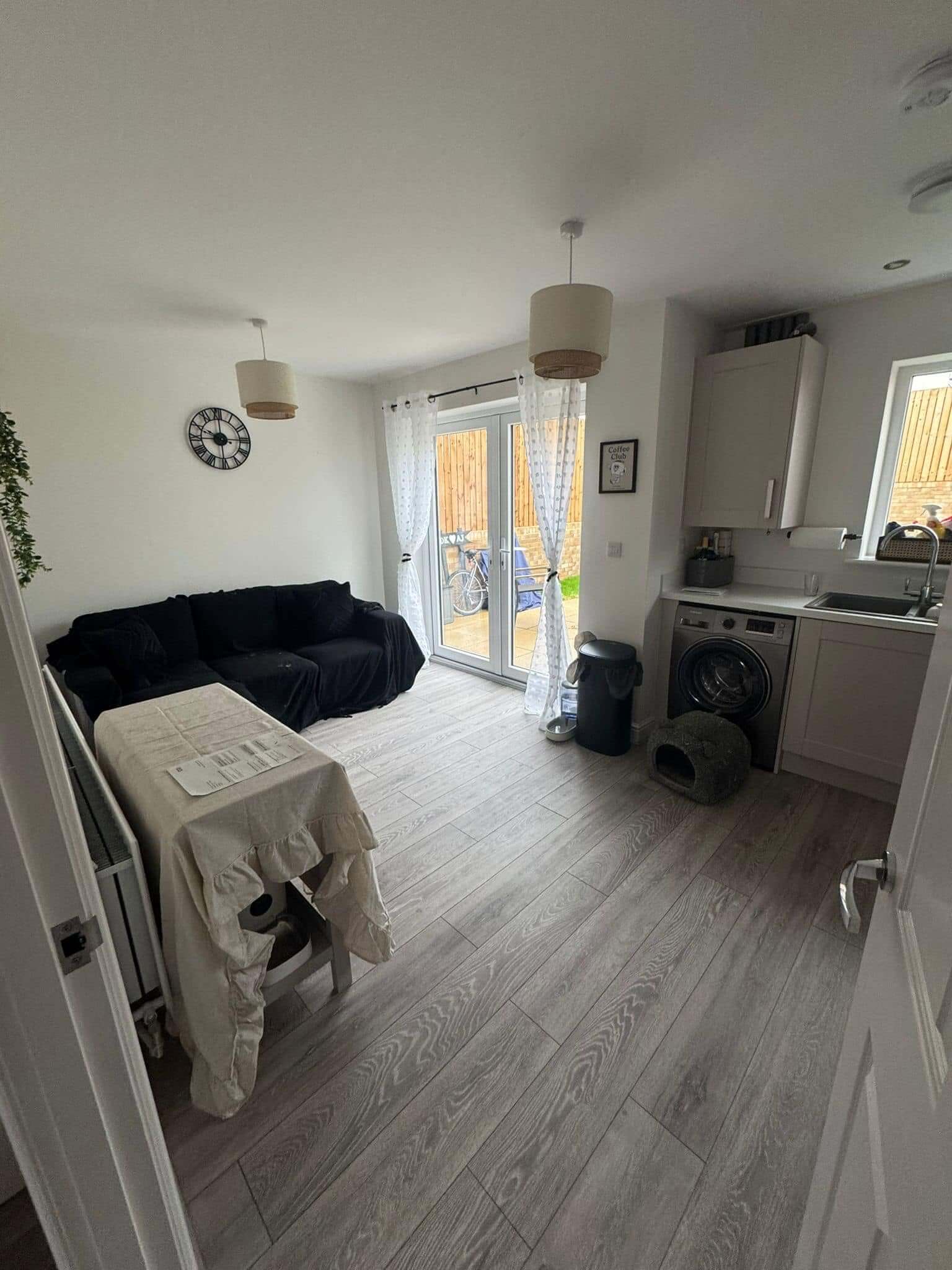 Finished Grey Oak Laminate Flooring in a Kendal Kitchen and Living Space