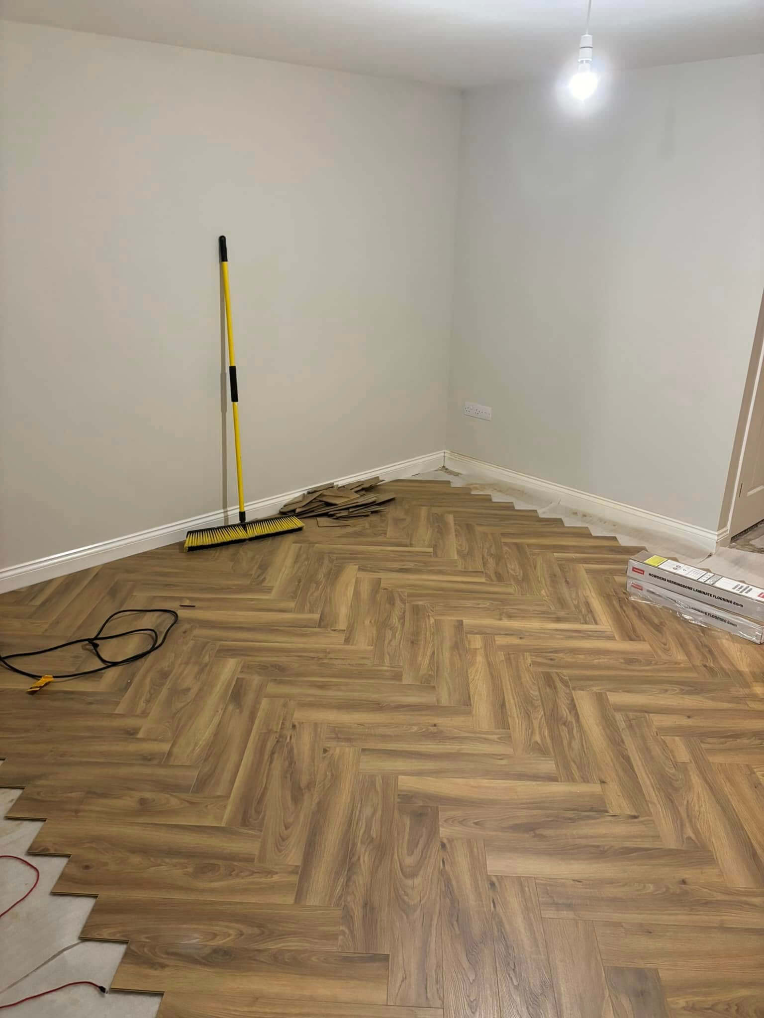 Herringbone Flooring Being Carefully Installed in a Morecambe Property