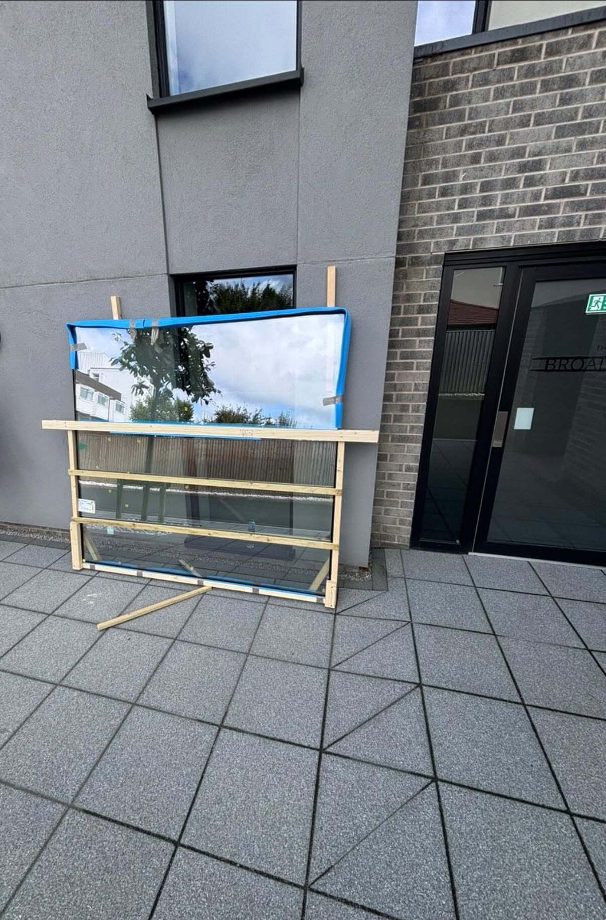 Large Replacement Window Pane Carefully Protected Before Installation