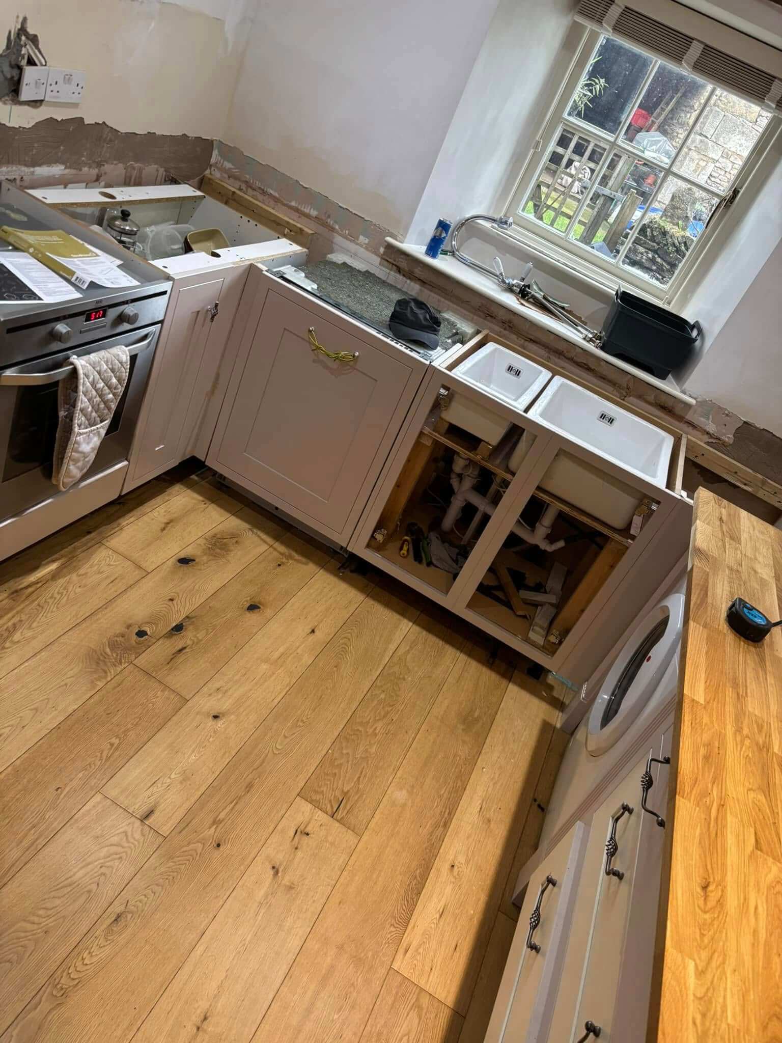 New Solid Oak Worktops Carefully Fitted Around the Kitchen Units and Sink